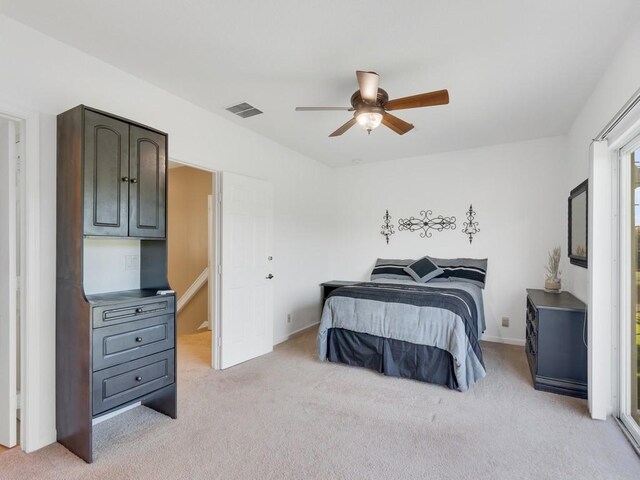 carpeted bedroom featuring a closet, ceiling fan, and access to outside