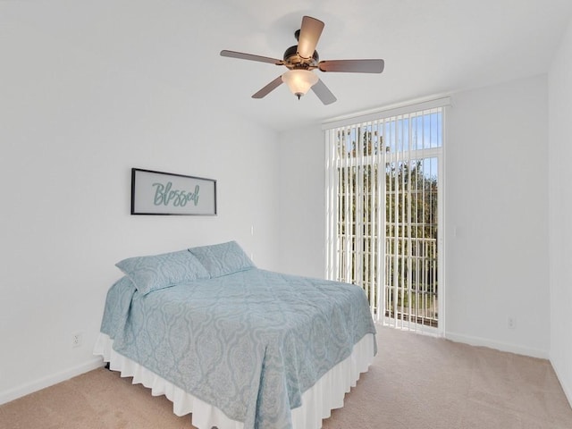 bedroom with light carpet, access to outside, a ceiling fan, and baseboards