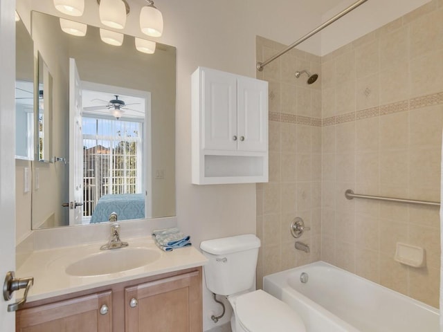 full bath featuring toilet, ensuite bath, ceiling fan, vanity, and shower / bathing tub combination