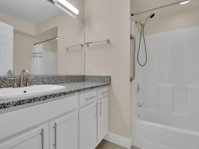 bathroom featuring vanity and shower / bath combination with curtain