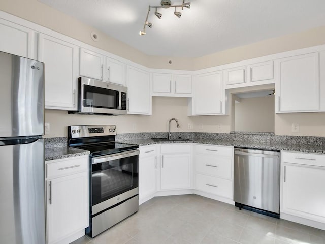 kitchen with white cabinets, sink, and stainless steel appliances