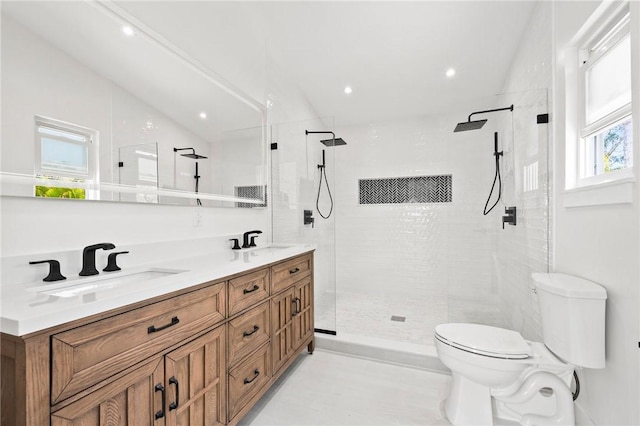 9670 Riverview Dr, Micco, FL 32976 - bathroom featuring double vanity, a tile shower, and recessed lighting