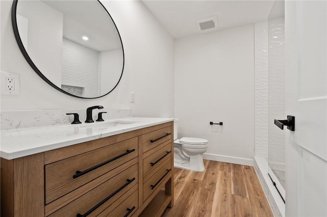 9670 Riverview Dr, Micco, FL 32976 - full bath with vanity, wood finished floors, and a shower