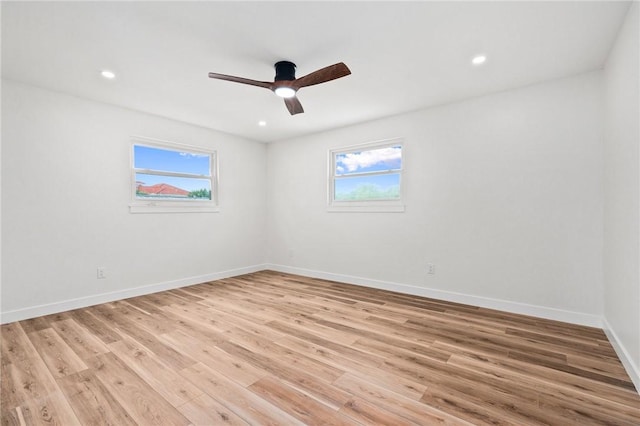 9670 Riverview Dr, Micco, FL 32976 - spare room featuring ceiling fan, light wood-style floors, and recessed lighting