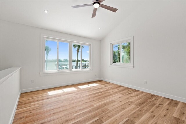 9670 Riverview Dr, Micco, FL 32976 - spare room featuring ceiling fan, light wood-style flooring, vaulted ceiling, and recessed lighting