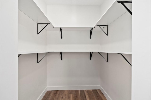 9670 Riverview Dr, Micco, FL 32976 - spacious closet with wood finished floors