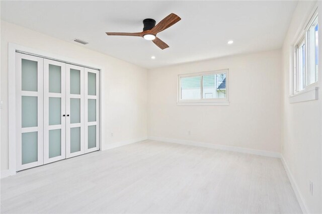 9670 Riverview Dr, Micco, FL 32976 - spare room with light wood-style flooring, ceiling fan, and recessed lighting