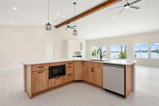 9670 Riverview Dr, Micco, FL 32976 - kitchen featuring dishwasher, open floor plan, a ceiling fan, light wood-type flooring, and recessed lighting