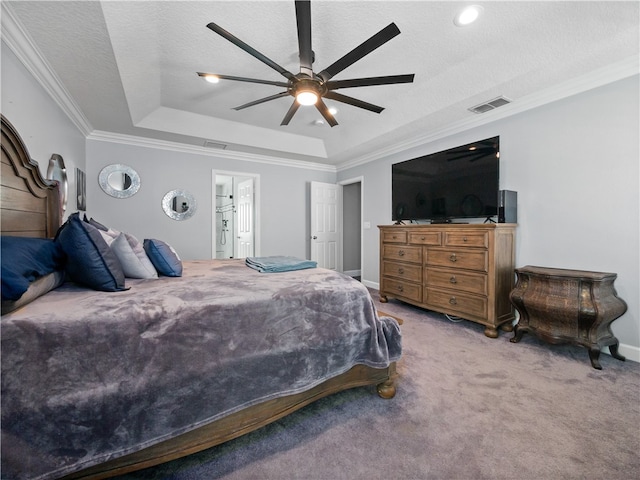 bedroom with carpet floors, ensuite bathroom, ceiling fan, a raised ceiling, and crown molding