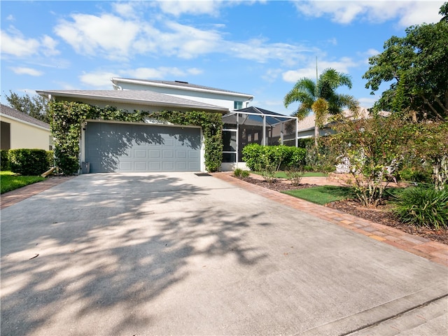 view of front facade featuring a garage and a lanai