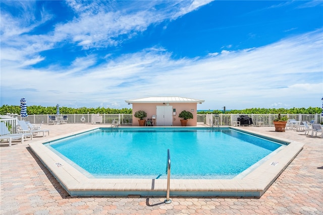 view of pool featuring a patio area