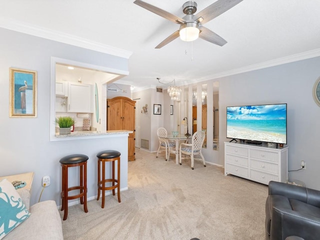 2800 Indian River Blvd Unit M7, Vero Beach, FL 32960 - living area featuring ornamental molding, a chandelier, ceiling fan, light colored carpet, and baseboards
