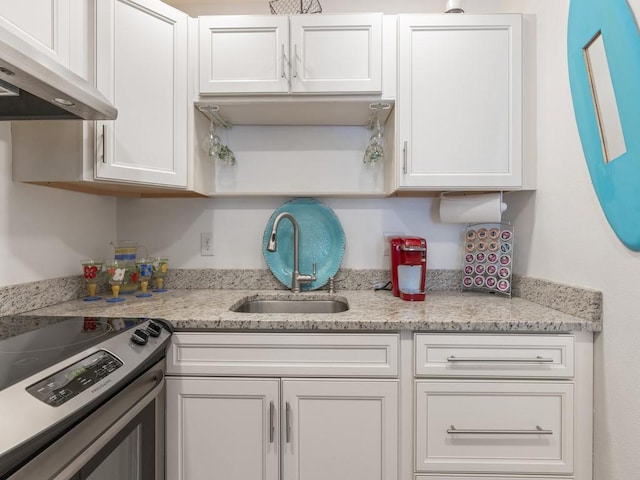2800 Indian River Blvd Unit M7, Vero Beach, FL 32960 - kitchen featuring ventilation hood, a sink, stainless steel range with electric stovetop, white cabinetry, and open shelves