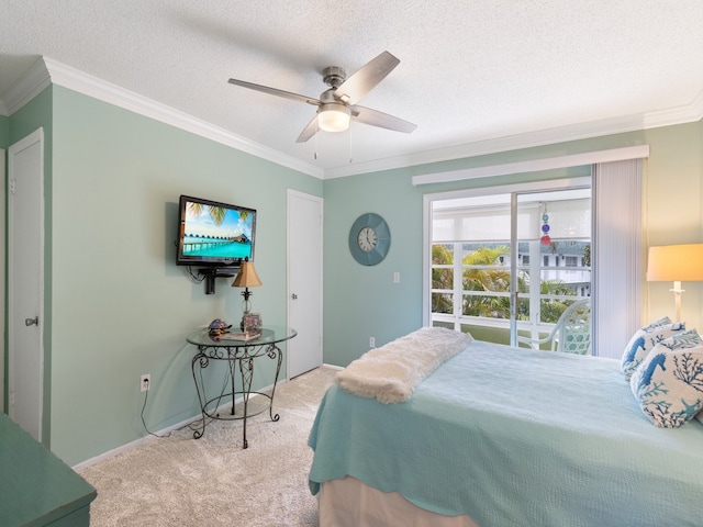 bedroom featuring ornamental molding, light colored carpet, and ceiling fan