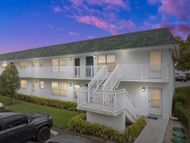 2800 Indian River Blvd Unit M7, Vero Beach, FL 32960 - property at dusk featuring stairway