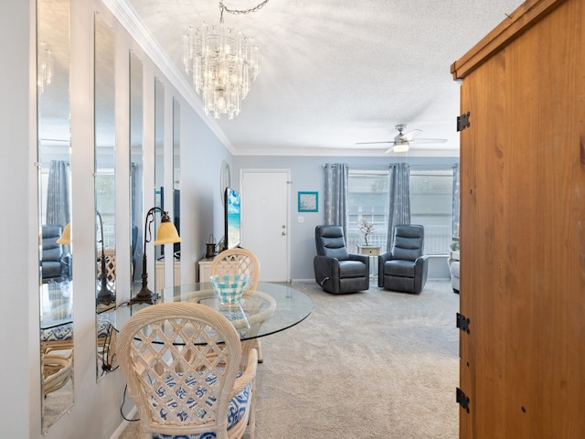 living room featuring ceiling fan with notable chandelier, a textured ceiling, crown molding, and carpet floors