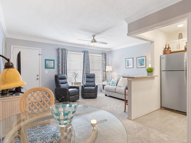 2800 Indian River Blvd Unit M7, Vero Beach, FL 32960 - living area featuring ceiling fan, light carpet, a textured ceiling, and ornamental molding
