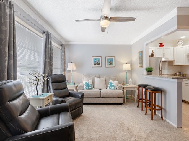 carpeted living room with a textured ceiling, ceiling fan, and crown molding