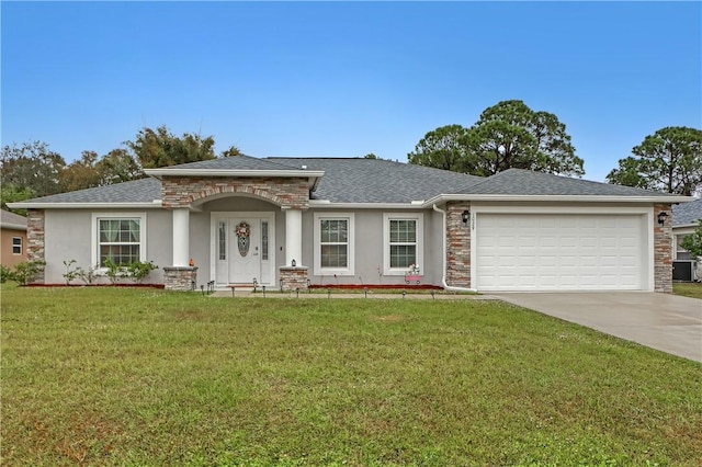 ranch-style home featuring a garage and a front lawn