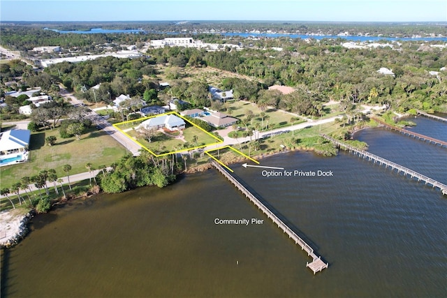 birds eye view of property featuring a water view