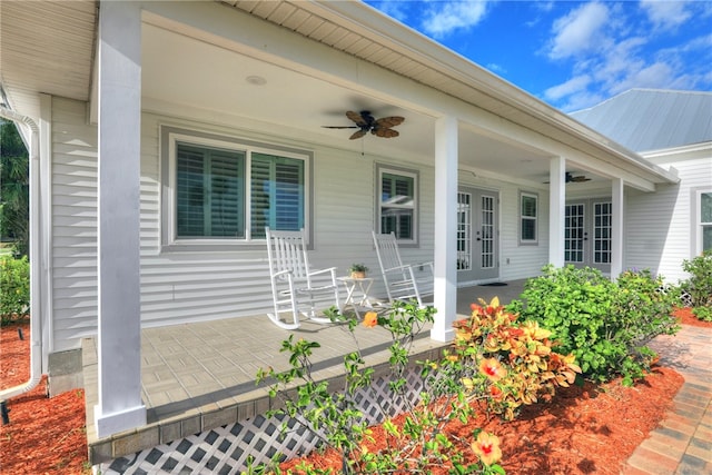 entrance to property featuring a porch and ceiling fan