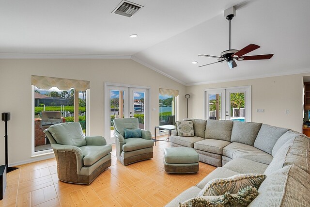 living room featuring french doors, lofted ceiling, ceiling fan, crown molding, and light hardwood / wood-style flooring