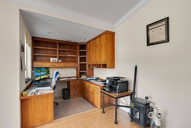 office area with built in desk and crown molding