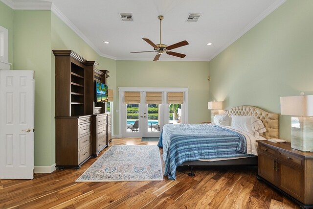 bedroom with french doors, dark wood-type flooring, access to exterior, ceiling fan, and crown molding