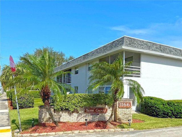 view of property exterior featuring a lawn