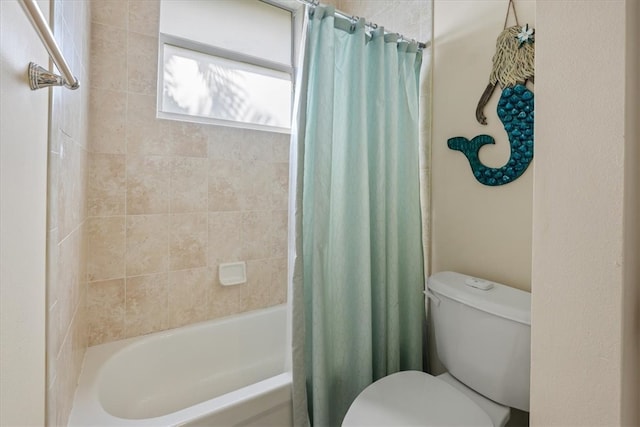 bathroom with toilet and shower / tub combo with curtain