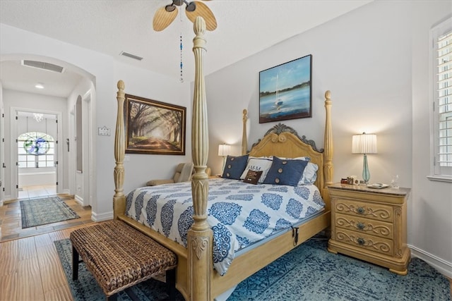 bedroom featuring hardwood / wood-style flooring and ceiling fan