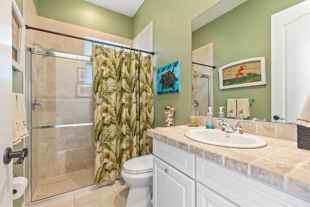 bathroom featuring toilet, vanity, tile patterned floors, and a shower with curtain