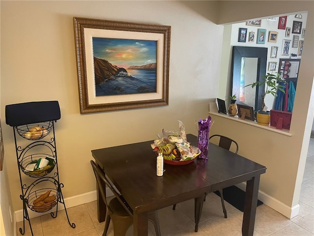 dining area featuring light tile patterned flooring