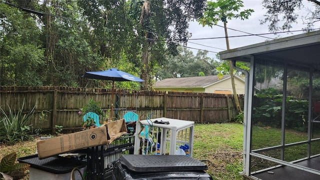 view of yard with a sunroom