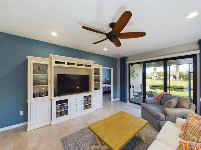 tiled living room with ceiling fan