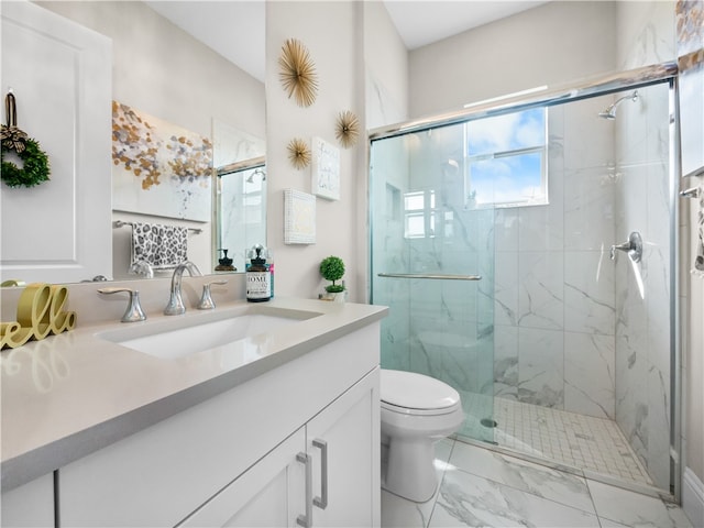 bathroom featuring walk in shower, vanity, and toilet