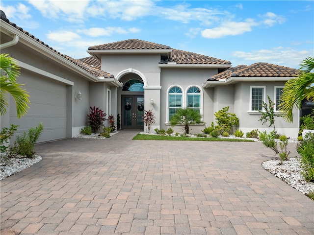 mediterranean / spanish-style house featuring a garage