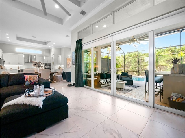 living room featuring a raised ceiling