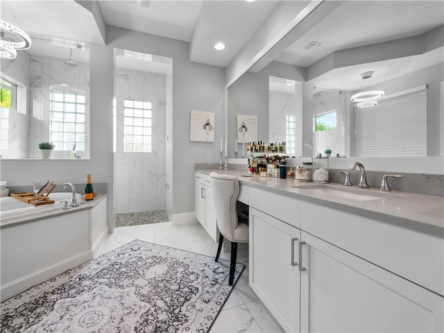 bathroom featuring vanity and tiled shower