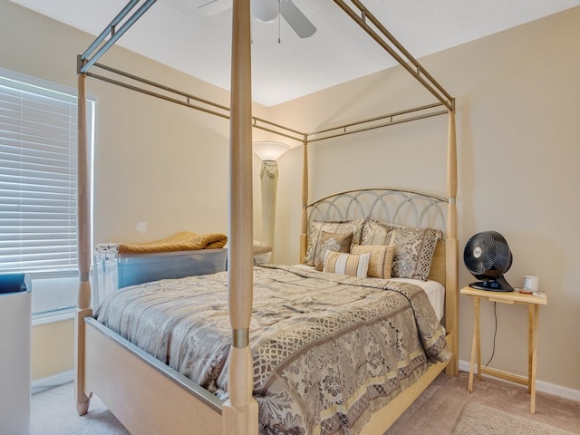 bedroom with light colored carpet and ceiling fan