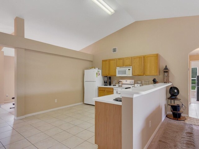 kitchen featuring light tile patterned floors, sink, white appliances, ceiling fan, and kitchen peninsula