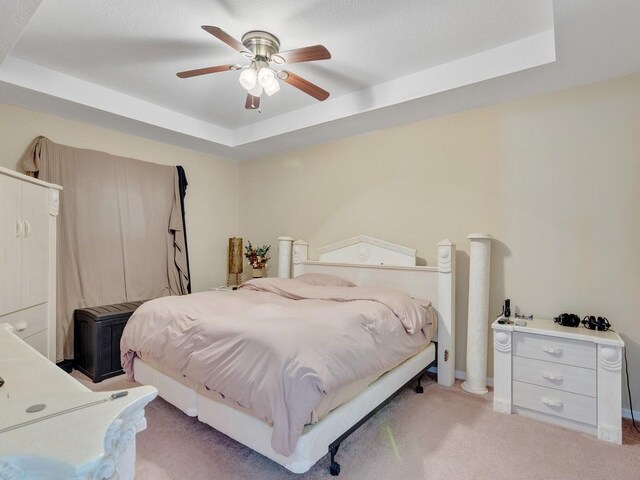 living room featuring ceiling fan, lofted ceiling, and light carpet