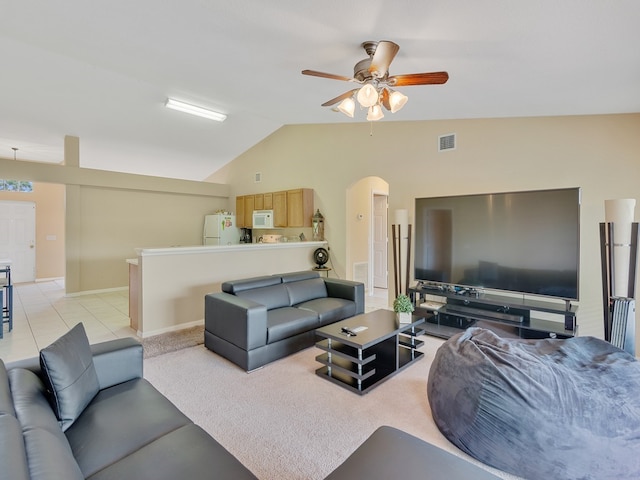 tiled living room with vaulted ceiling and ceiling fan