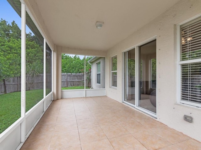 unfurnished sunroom featuring a healthy amount of sunlight