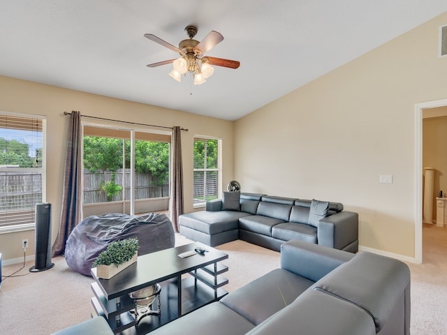 living room with ceiling fan, lofted ceiling, and carpet floors