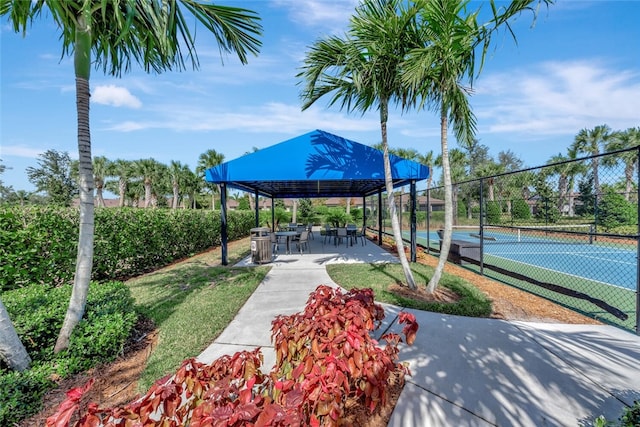 surrounding community with tennis court