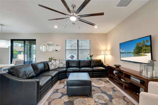 living room with ceiling fan and a healthy amount of sunlight