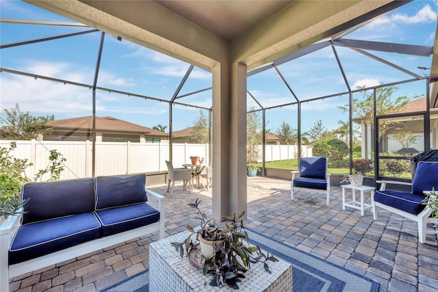 view of patio with outdoor lounge area and a lanai