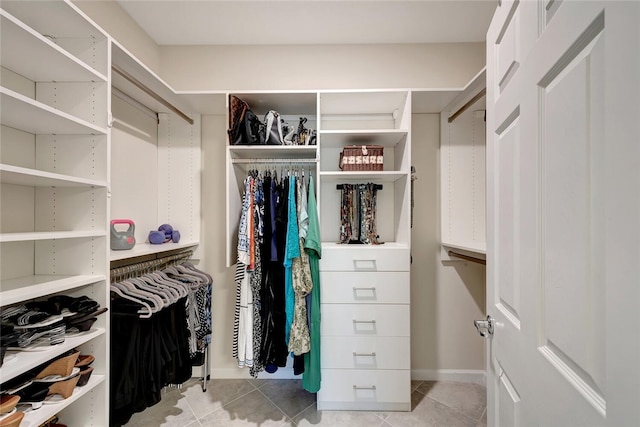 walk in closet featuring light tile patterned floors