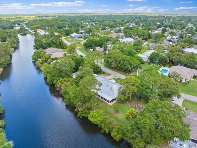 aerial perspective of suburban area with a large body of water